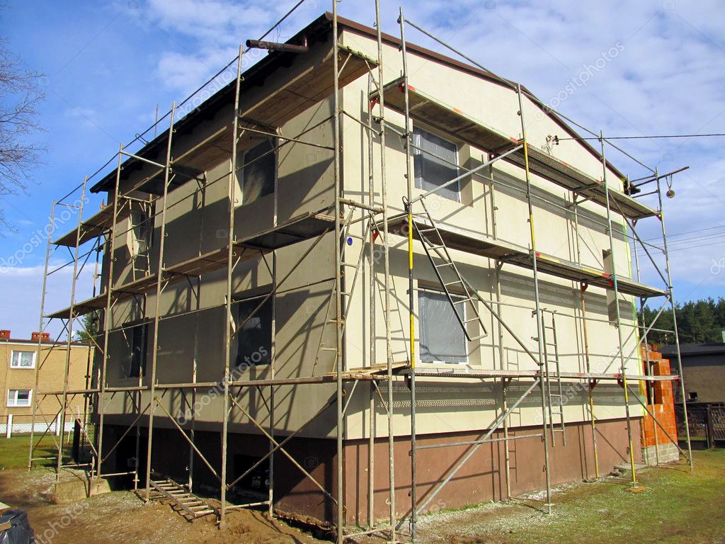 Rissgewebe und Spachtel an Fassade